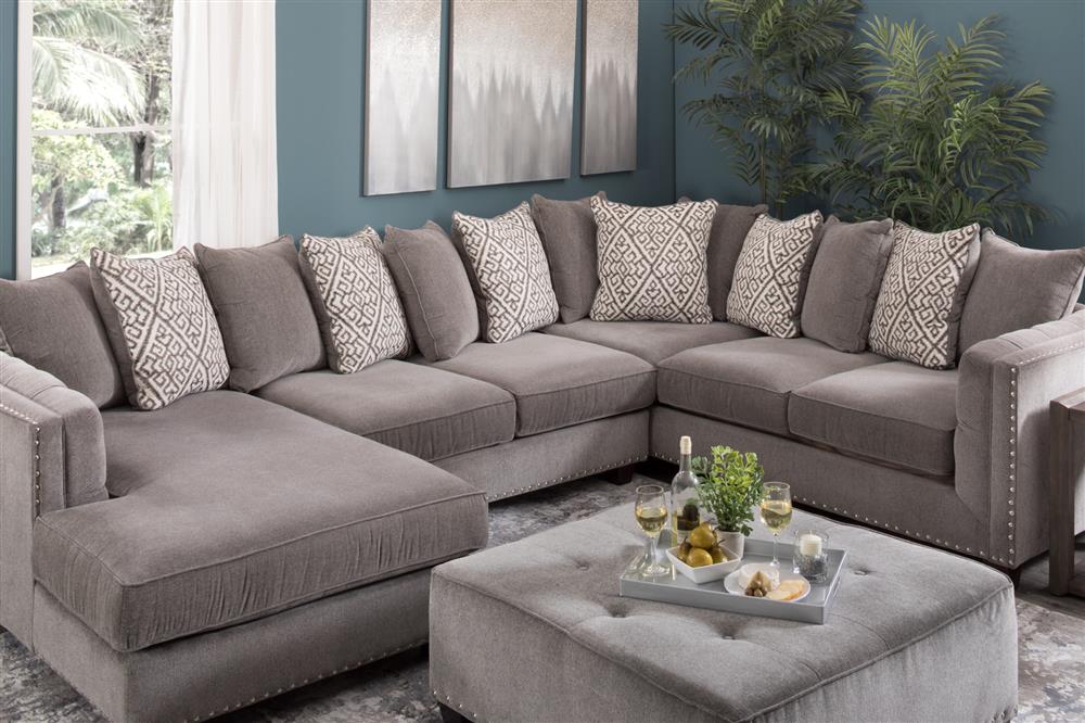 blue sectional with ottoman in living room